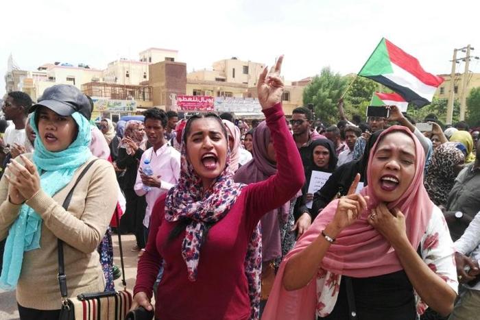 Sudanese protesters march in the capital's Bahri district to denounce the Al-Obeid killings