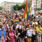 People wave rainbow flags during the Baltic gay pride parade on June 8, 2019 on the streets of the Polish capital Warsaw