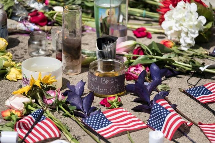 Candles and flowers a placed in front of Ned Peppers bar after the mass shooting over the weekend in Dayton, Ohio