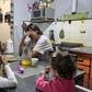 Between the two of them, Argentine couple carpenter Ariel Fernandez (2nd R) and his wife, teacher Natalia Morales (L), earn the equivalent of around $1,200 a month as more and more people in the country fall below the poverty line
