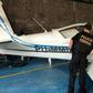 A federal police officer inspects an airplane seized during an anti drugs sweep in February 2019 at a hangar in Palmas, Tocatins state, central Brazil
