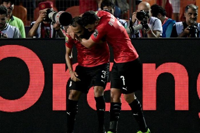 Egypt's defender Ahmed Elmohamady (L) and Mahmoud 'Trezeguet' Hassan starred as Egypt finished Group A with a perfect record