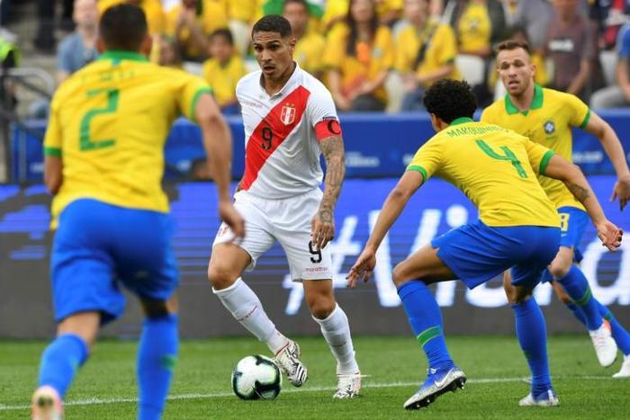 Peru striker Paolo Guerrero (second from left) was well shackled by Brazil's defense when the two sides met in the Copa America group stage