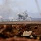 Smoke billows from buildings in the jihadist-held village of Tal Maleh in northwest Syria's Hama province shows on June 9, 2019 as pro-regime forces pound the site
