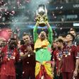 Adrian raises aloft the UEFA Super Cup after his save in the penalty shoot-out allowed Liverpool to beat Chelsea in Istanbul