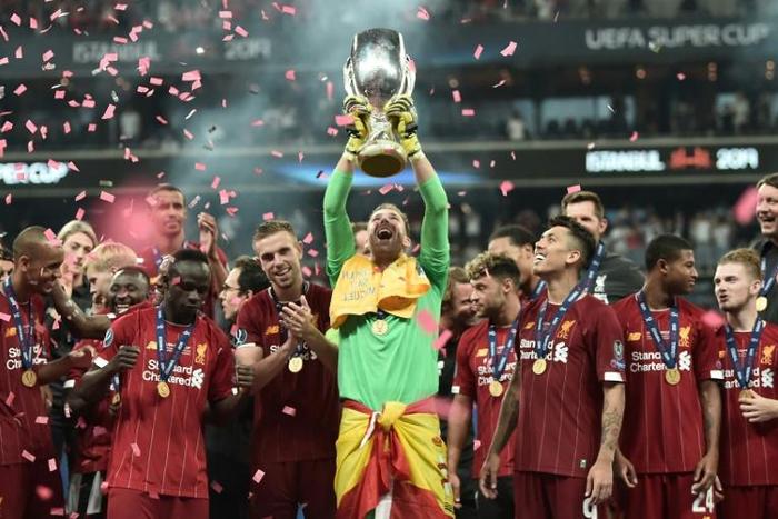 Adrian raises aloft the UEFA Super Cup after his save in the penalty shoot-out allowed Liverpool to beat Chelsea in Istanbul