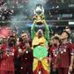 Adrian raises aloft the UEFA Super Cup after his save in the penalty shoot-out allowed Liverpool to beat Chelsea in Istanbul