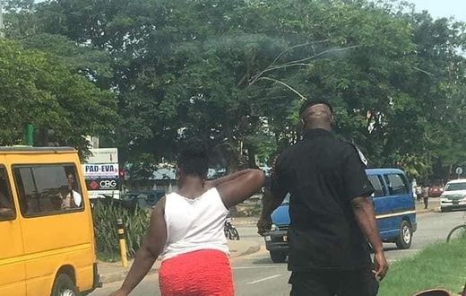 Woman made to pick litter after caught throwing sachet water bag on the street