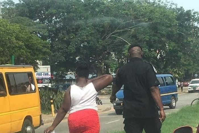 Woman made to pick litter after caught throwing sachet water bag on the street