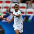 Nikita Parris (R) celebrates with skipper Steph Houghton after putting England in front against Scotland from the penalty spot