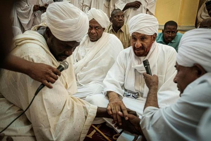 Sudanese opposition leader and former premier Sadiq al-Mahdi attends Friday prayers at a mosque linked to his National Umma Party in Khartoum's twin city of Omdurman on June 14, 2019