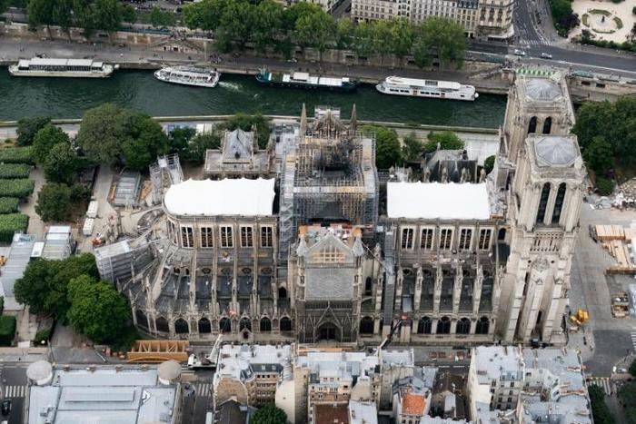 Three months after the fire the race to make good the extensive damage to the UNESCO world heritage site is on -- but the issue is a political hot potato, not least on grounds of cost