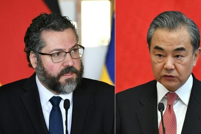 Brazilian Foreign Minister Ernesto Araujo (L) is likely to adopt a more conciliatory tone when he meets his Chinese counterpart Wang Yi (R) in the Brazilian capital of Brasilia