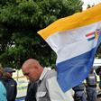 April 2010: White supremacists brandish the apartheid-era flag outside a court in Ventersdorp ahead of the trial of two men accused of killing far-right leader Eugene Terre'Blanche