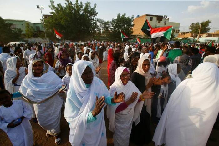 Sudanese women applauded on Saturday in celebration of a power sharing agreement between protest leaders and the ruling military council