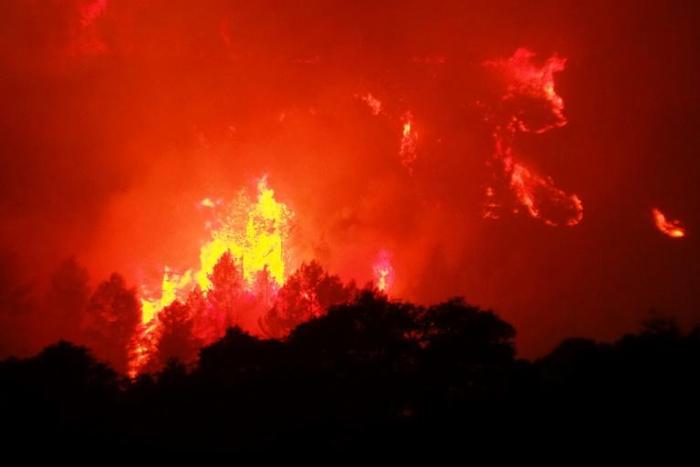 A fire fanned by a strong wind raged early Thursday in the Aude department of southern France.