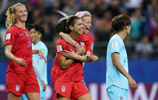 Alex Morgan (2nd right) celebrated her five-goal haul with Megan Rapinoe