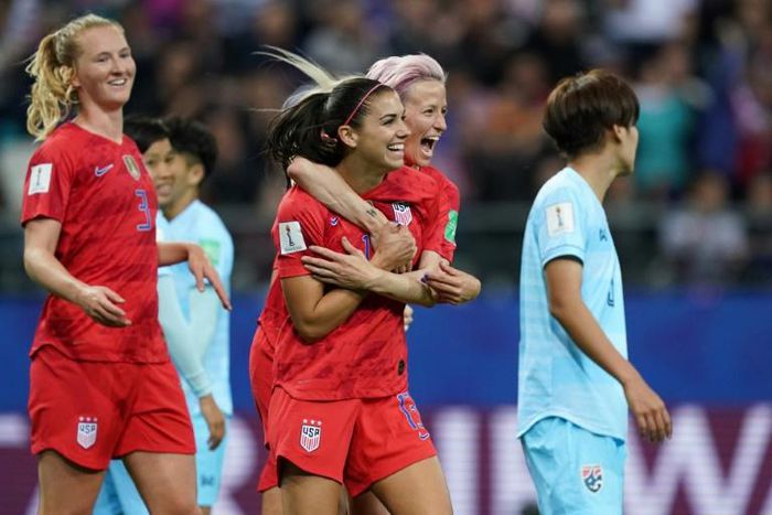 Alex Morgan (2nd right) celebrated her five-goal haul with Megan Rapinoe