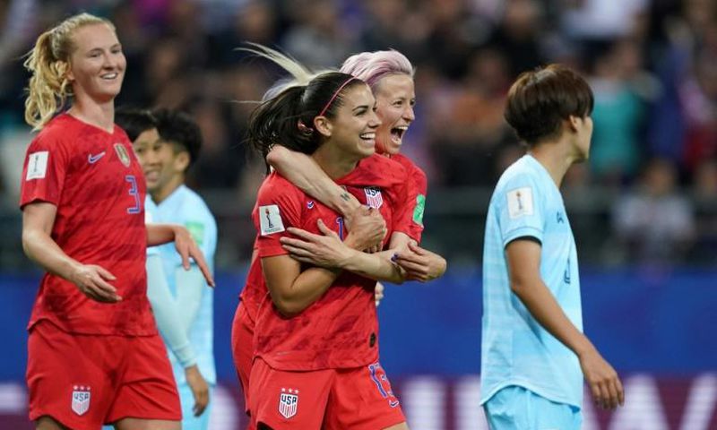 Alex Morgan (2nd right) celebrated her five-goal haul with Megan Rapinoe