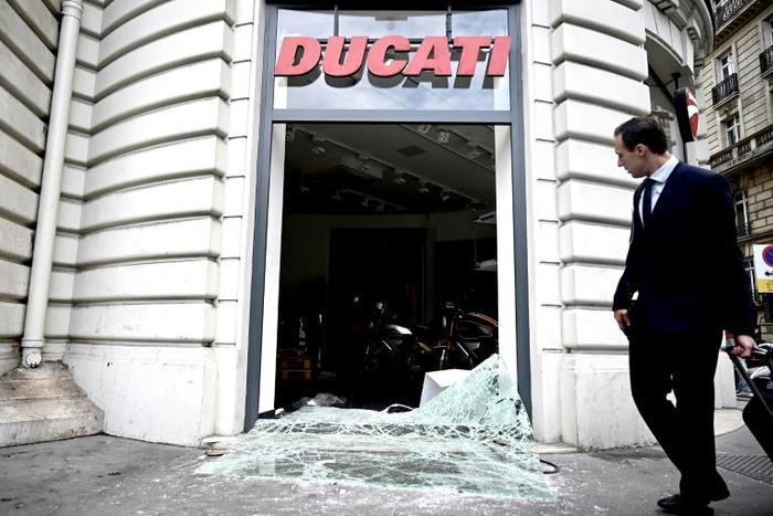 Two stores near the Champs-Elysees in Paris were looted, including a motorcycle shop where people took helmets, gloves and even bikes