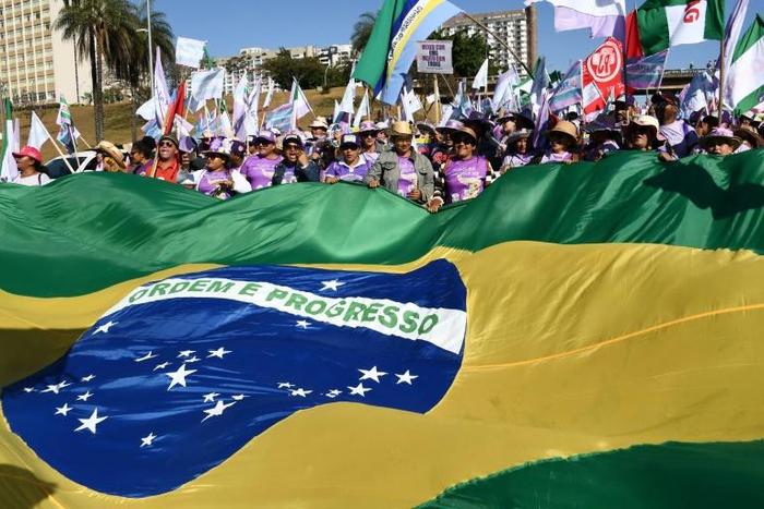 Women march against Brazilian President Jair Bolsonaro in the capital Brasilia