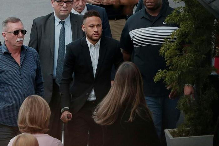Neymar arrived at the police station on crutches for questioning