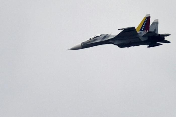 A Venezuelan Air Force Russian-made SU-30 fighter, like this one pictured over Caracas in 2013, is accused of jeopardizing the safety of the US crew and aircraft