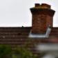 File picture shows a plane flying over residential houses as it prepares to land at London Heathrow Airport