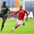 Madagascar midfielder Marco Ilaimaharitra (L) pursues Nigerian Oghenekaro Etebo during the Africa Cup of Nations in Egypt