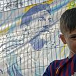 Brazilian six-year-old Lionel Messi Maier waits in vain to catch a glimpse of his Argentine hero and namesake