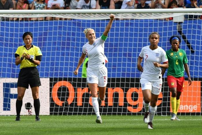 Steph Houghton raises her arm in celebration after putting England ahead against Cameroon in the last 16 of the women's World Cup