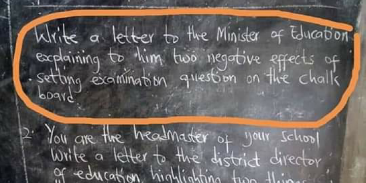 Teachers write exam questions on chalkboards