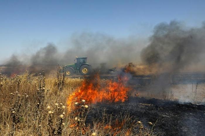 Balloons with attached incendiary devices are flown over the Gaza border by Palestinian demonstrators seeking to start fires in nearby Israeli farmland