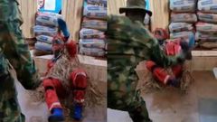 Fearless soldier’s beatings forces masquerade to speak and plead for mercy (video)