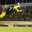 Jamaica's Dever Orgill celebrates his goal against Honduras with a somersault