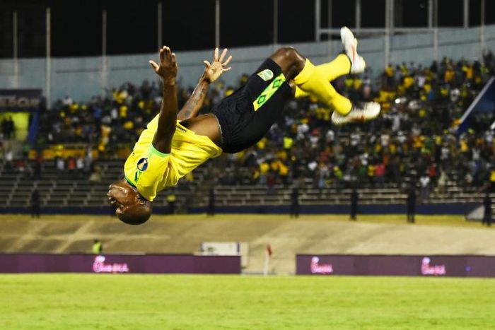 Jamaica's Dever Orgill celebrates his goal against Honduras with a somersault
