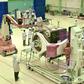 Scientists work on the orbiter vehicle of Chandrayaan-2, India's first moon lander and rover mission