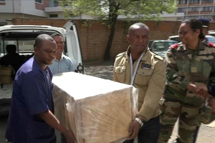 The coffin containing the remains of British Cambridge University student Alana Cutland was carried out from the morgue