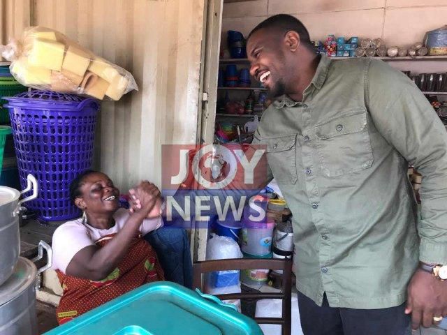 John Dumelo in Tesano market