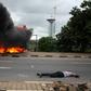 A member the shiite Islamic Movement of Nigeria (IMN) lies on the ground after being shot dead during clashes between IMN and the police in the streets of Abuja on July 22, 2019. The Shiites are protesting against the detention of IMN leader Ibrahim Za...