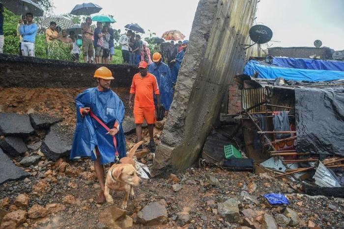 The death toll from a wall collapse in a Mumbai slum rose to 26 as the city braced for more rain