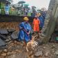 The death toll from a wall collapse in a Mumbai slum rose to 26 as the city braced for more rain