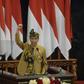 President Joko Widodo, wearing a traditional outfit for his address, wants to relocate the Indonesian capital to the island of Borneo but did not give a timetable for the move