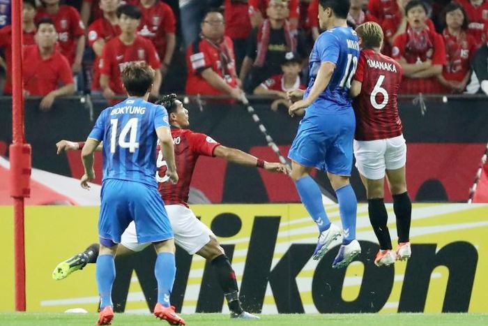 Ulsan's Joo Min-kyu (number 11) rises to head the equaliser against Urawa Reds in Saitama