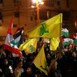 Lebanese supporters of the Shiite Hezbollah party wave Lebanese national and party (yellow) flags, as they march in Beirut in May