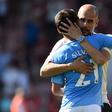 Manchester City manager Pep Guardiola embraces Spanish midfielder David Silva