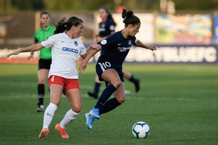 Sky Blue's forward Carli Lloyd (R) fights for the ball with Washington Spirit's midfielder Jordan DiBiasi (L) during the National Women’s Soccer league match between Sky Blue and Washington Spirit on July 24, 2019