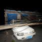 A car was crushed by a pole near the site of the explosion at the Henan Coal Gas Group factory in Yima city