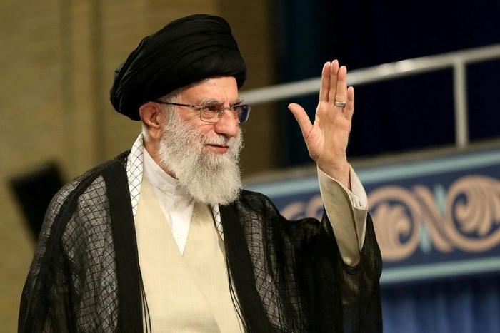 Iran's supreme leader Ayatollah Ali Khamenei gestures to the crowd during a ceremony attended by clerics in the capital Tehran