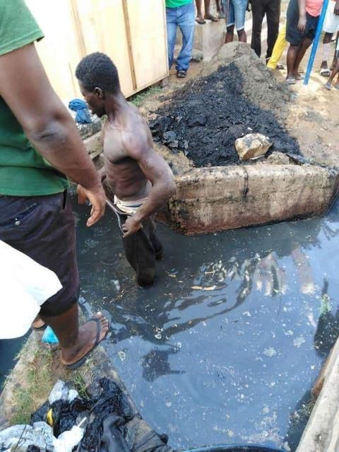 Residents beat up 'thief', gave him food and drinks before supervising him to clean their choked gutters (photos)